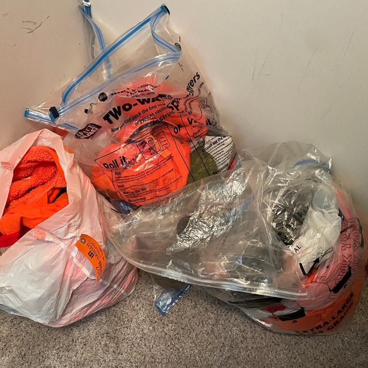 #7307 • (4) Bags of Hunting Clothing