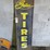 gates-tires-painted-tin-sign-image-2