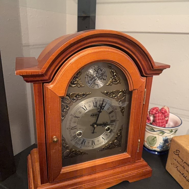 31 day wind, chiming mantle clock. Has Pendleton, less key. Includes miscellaneous items pictured