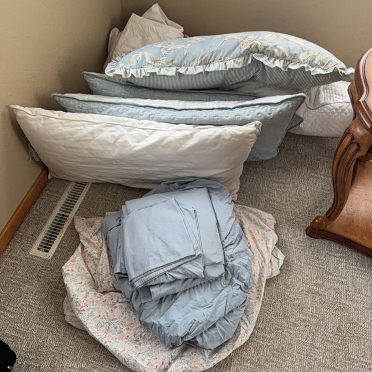 Pile of king-size bedding and pillows