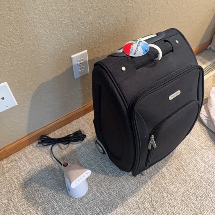 Wrinkle remover and like new Travelon pull type suitcase