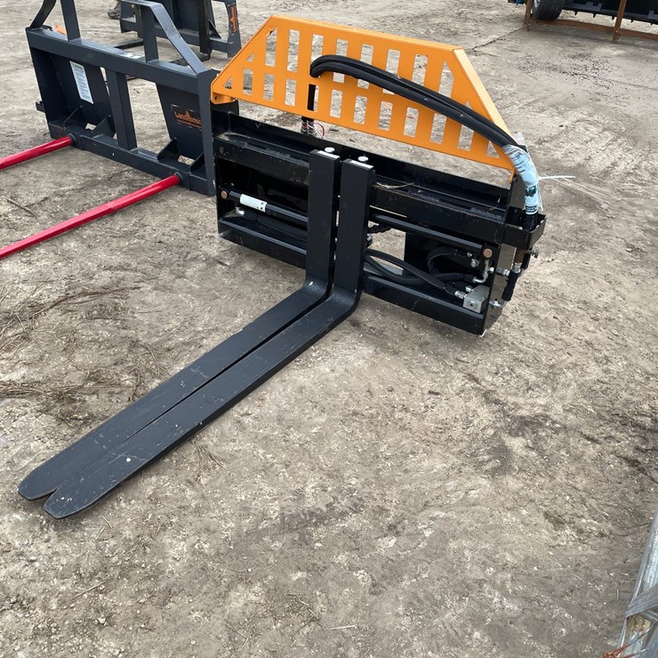 #9799 • Wolverine Hydraulic Pallet Fork Attachment