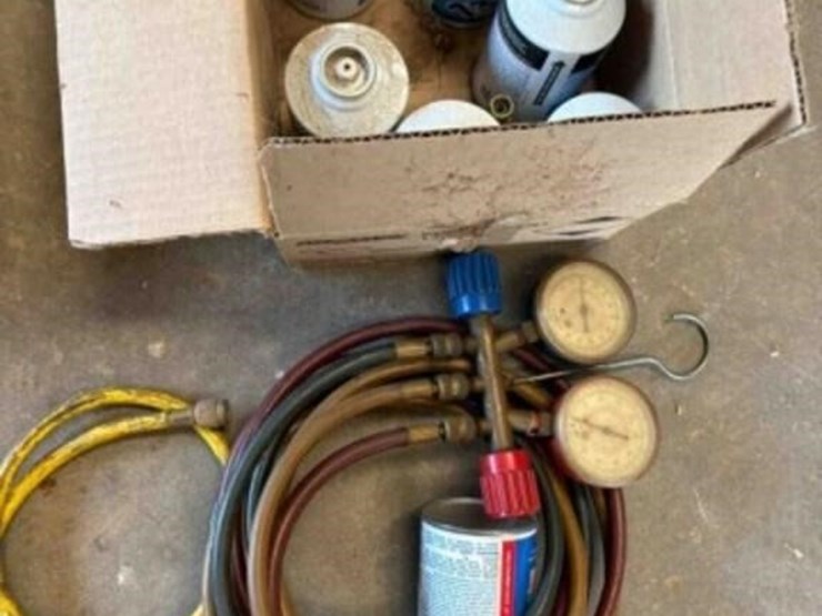 hvac-guage-and-7-cans-of-134a-image-1