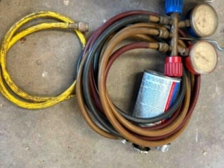hvac-guage-and-7-cans-of-134a-image-4