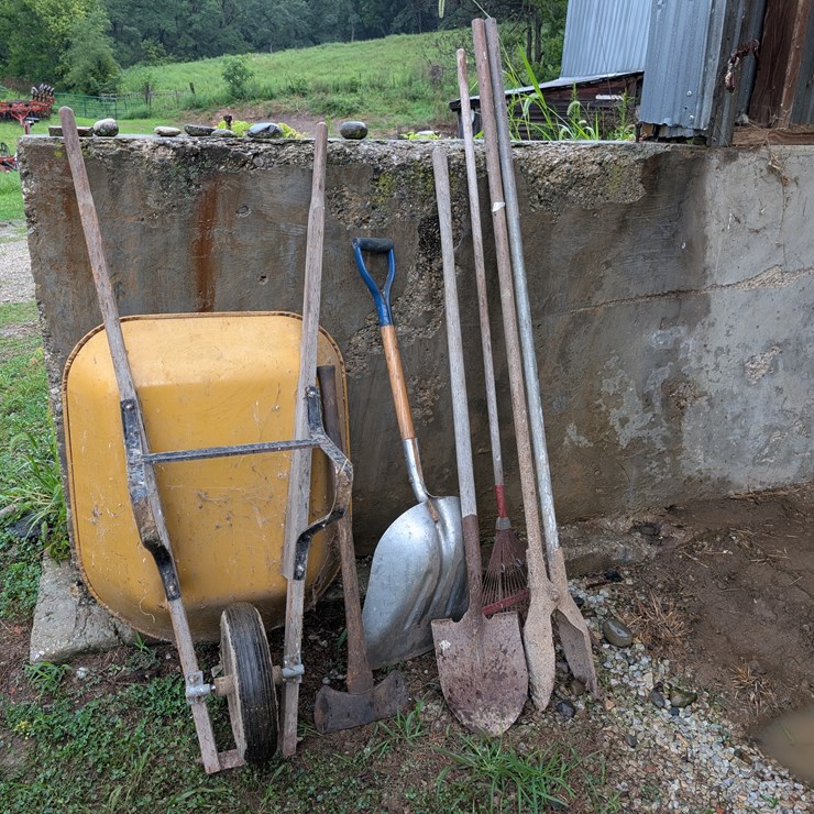 Assortment of hand tools and wheelbarrow. #242