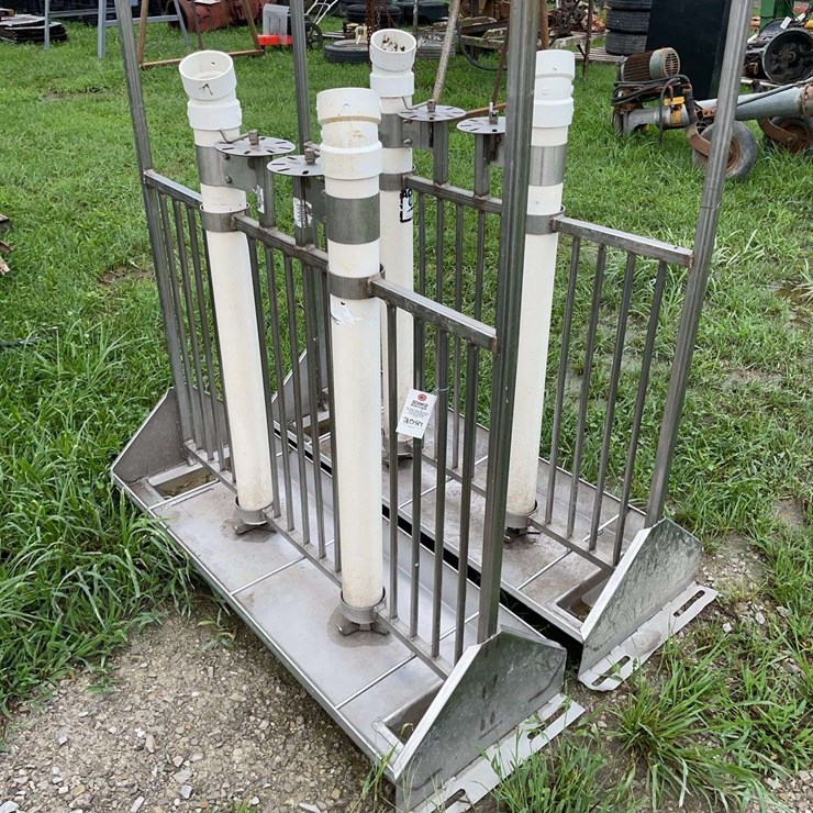 2 nursery hog feeders with pitch fork