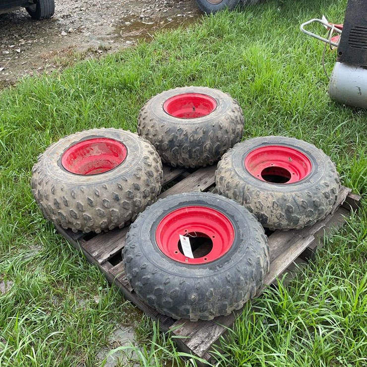 Pair of 24x11.00x10NHS tires on 4 bolt rims & pair of 22x8.00x10NHS tires on 4 bolt rims