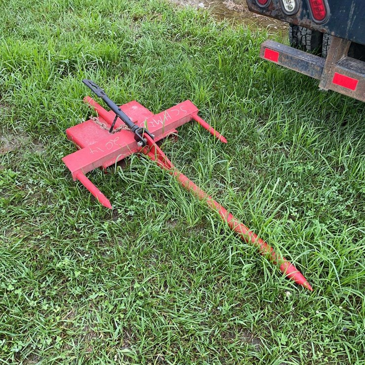 Bale spear that slides on forks