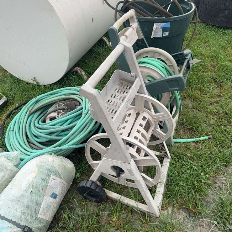 Assortment of hose and 2 hose reels