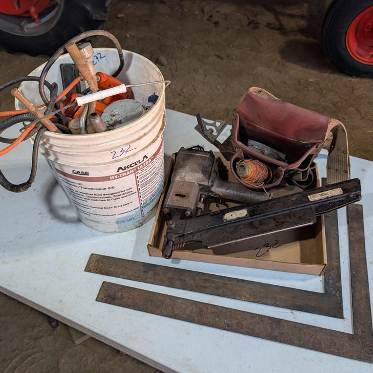 Misc. carpenter tools to include air nailer and squares. #232