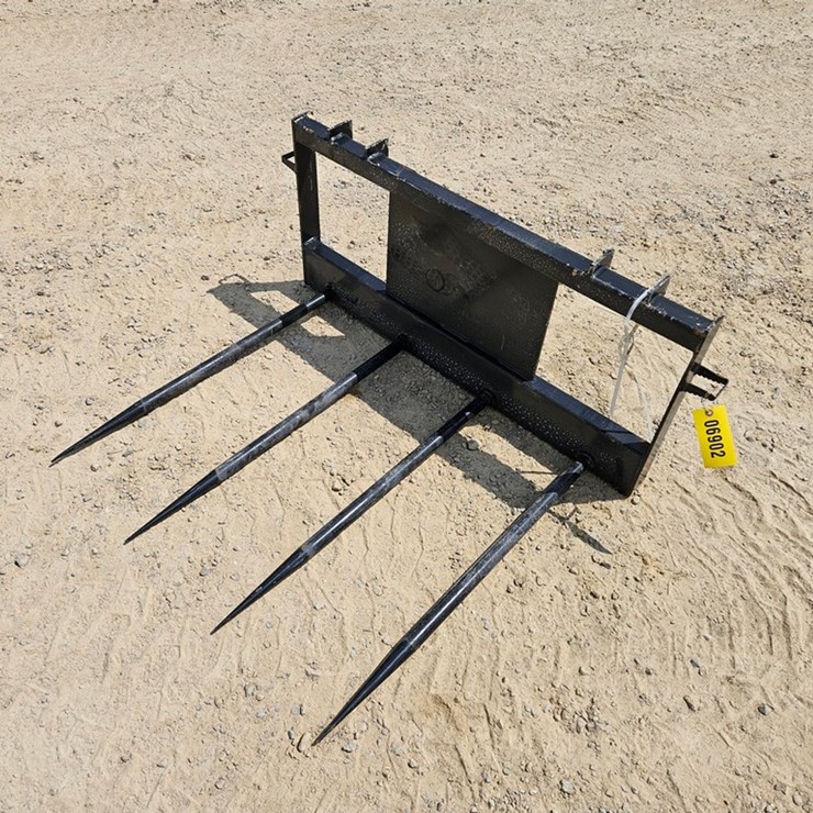 #6902 • New Land Honor 4 Spear Bale Mover