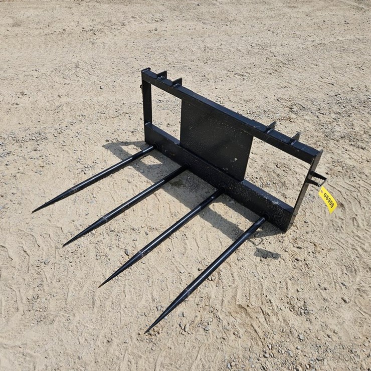 #6909 • New Land Honor 4 Spear Bale Mover
