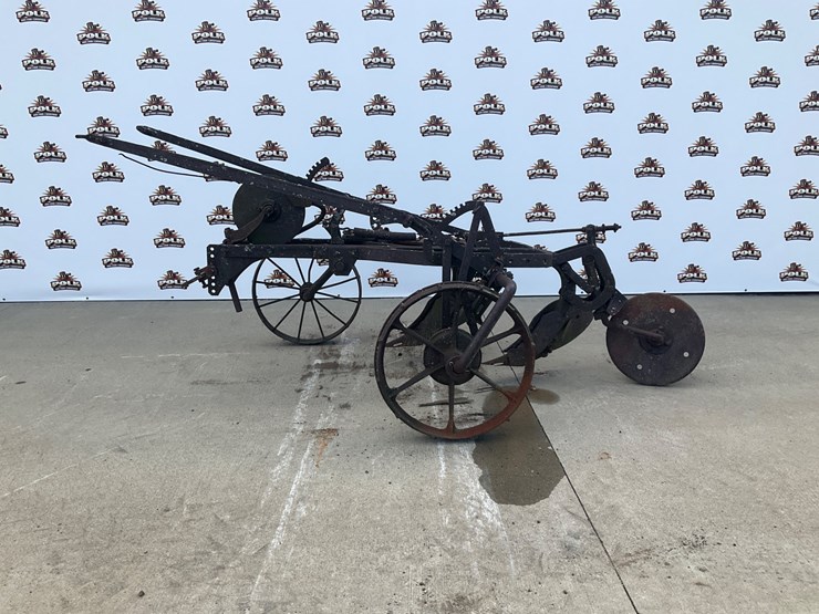 #5303-•-antique-2-bottom-pull-type-moldboard-plow-on-steel-wheels-image-1