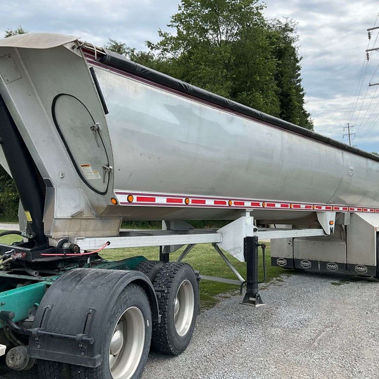 2012 Mac Dump Trailer, Half round, spread axle w/ front lift, new 10 foot 3/8” liner, new tarp w/ poly bows, decent tires and brakes, clean IL title