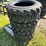 set-of-4-new-10-16.5-skid-steer-tires-image-1