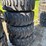 set-of-4-new-12-16.5-skid-steer-tires-on-rims-image-1