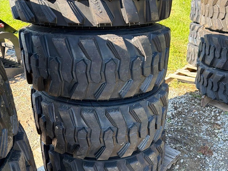 set-of-4-new-12-16.5-skid-steer-tires-on-rims-image-1
