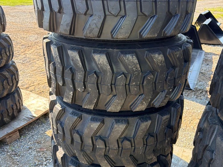 set-of-4-new-12-16.5-skid-steer-tires-on-rims-image-1