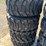 set-of-4-new-10-16.5-skid-steer-tires-image-1