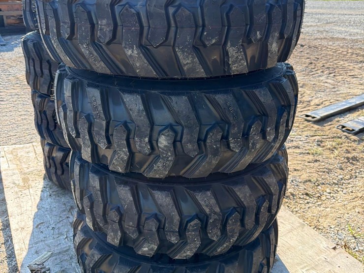 set-of-4-new-10-16.5-skid-steer-tires-on-rims-image-1