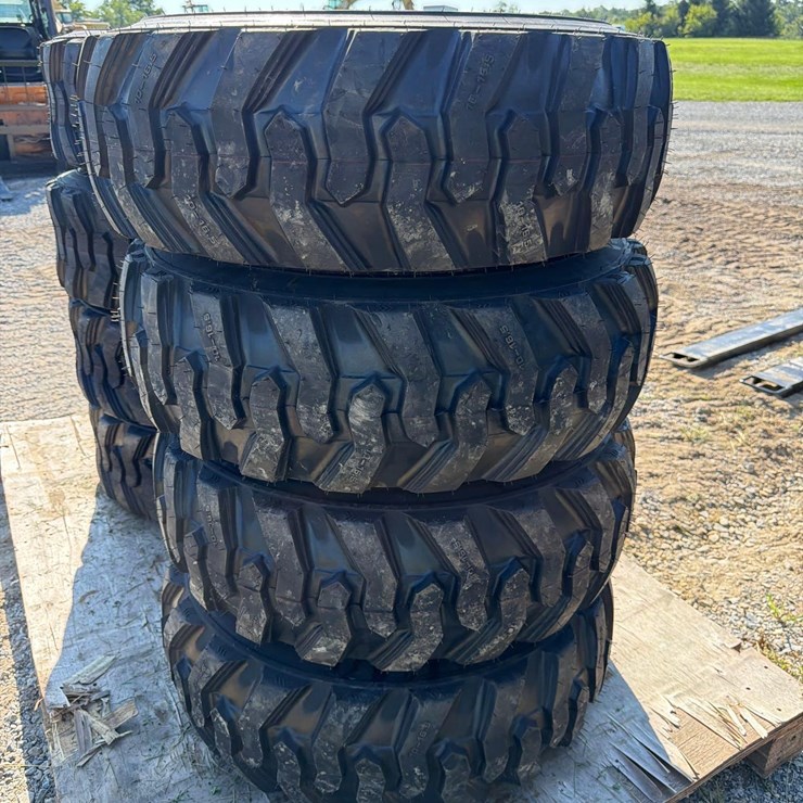 Set of 4 NEW 10-16.5 Skid Steer Tires on Rims
