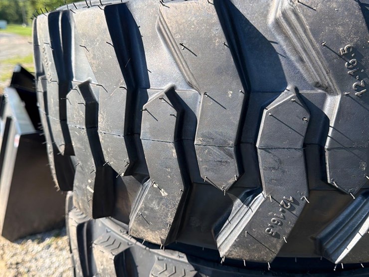 set-of-4-new-12-16.5-skid-steer-tires-on-rims-image-3