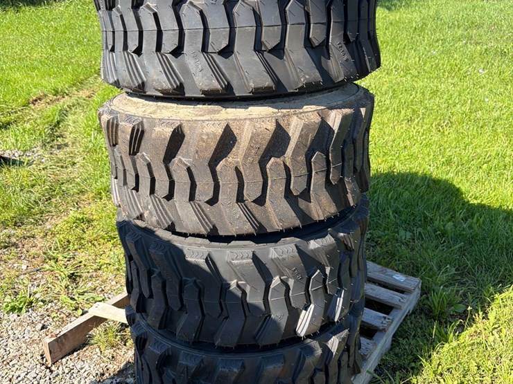 set-of-4-new-12-16.5-skid-steer-tires-image-1
