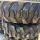 set-of-4-new-10-16.5-skid-steer-tires-on-rims-image-3