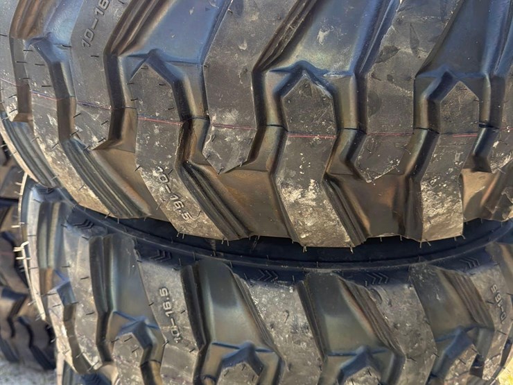 set-of-4-new-10-16.5-skid-steer-tires-on-rims-image-3