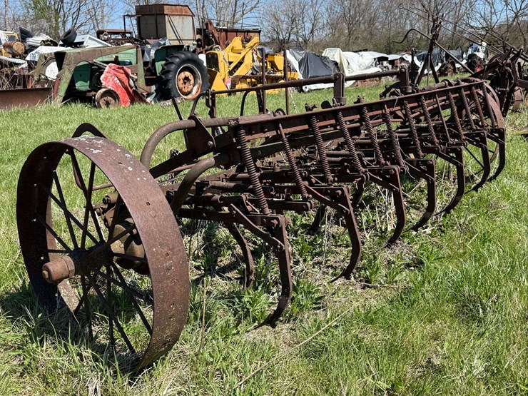 horse-drawn-13-shank-spring-tooth-harrow-cultivator-9’4”-working-width-steel-wheels.-image-1