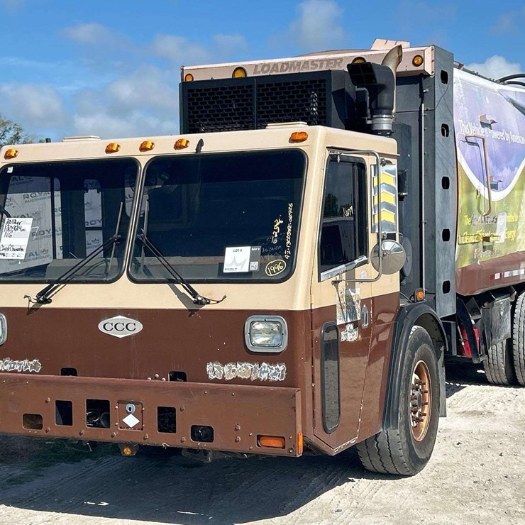2012 Crane Carrier Co. Low Entry T/A Loadmaster Rear Loader Garbage Truck