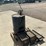 #5055-•-55-gallon-drum-with-great-plains-industries-hp100-pump-and-set-of-ramps-image-4