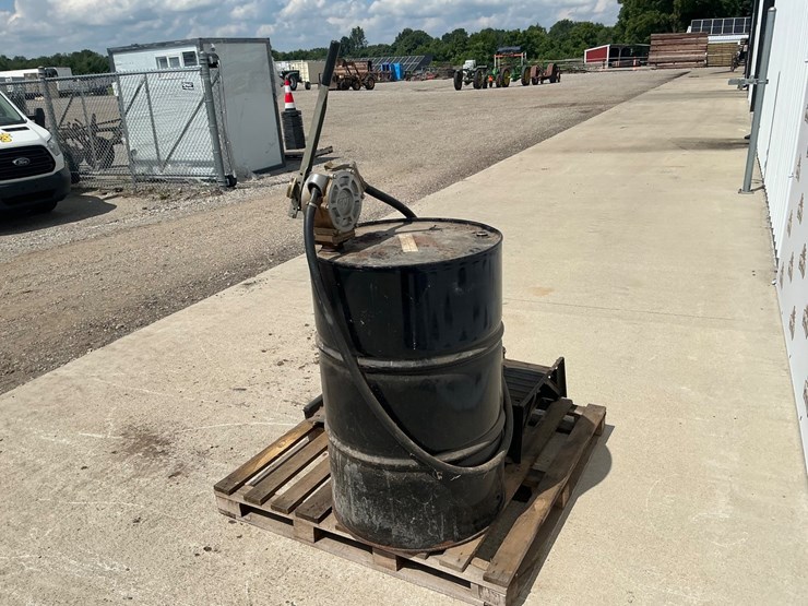#5055-•-55-gallon-drum-with-great-plains-industries-hp100-pump-and-set-of-ramps-image-3