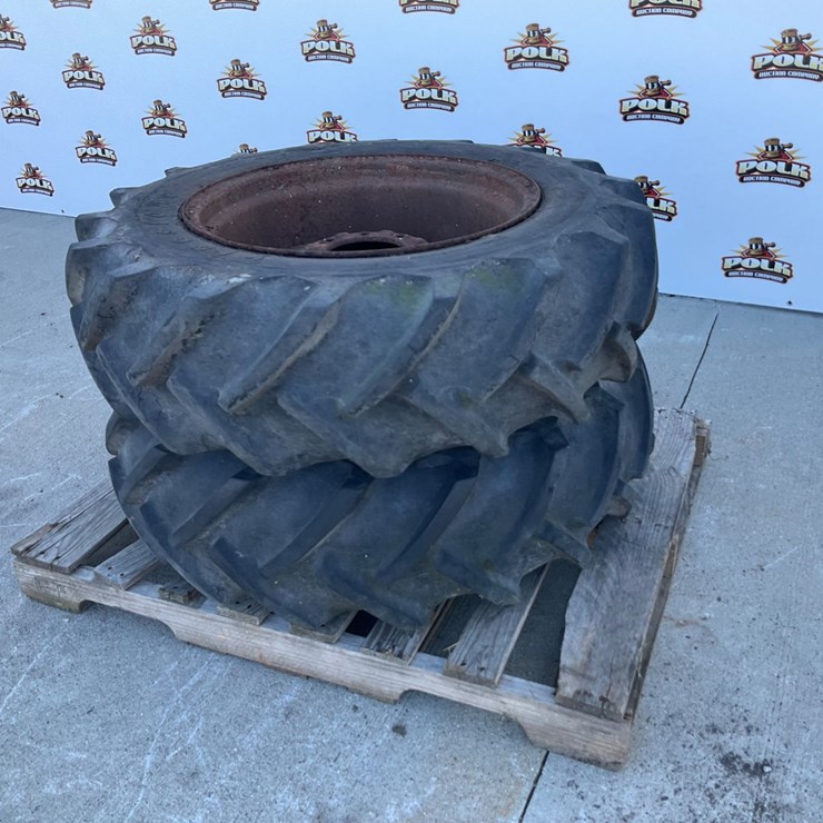 #5046 • (2) Firestone 12.4-24 Agricultural Tractor Tires on Steel Rims