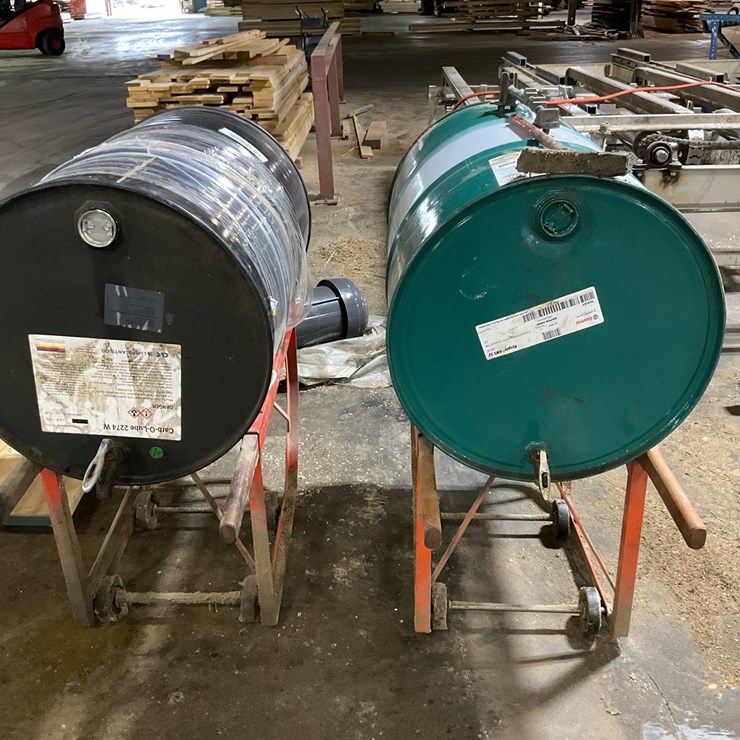 #211 • (2) 55-Gallon Lubricant Drums with Wheeled Cradles