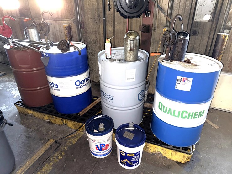 section-w/-4--55-gal-drums-&-5-gal-pails-mostly-full-of-machining-cooling-lubricants-w/-hand-pumps-&-catch-pans-image-1