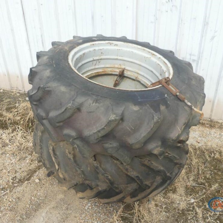 SET OF 18.4-34 DUAL TIRES W/ FORD RIMS