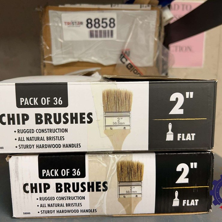 Assorted 2" flat chip brushes and caulk guns, multiple boxes