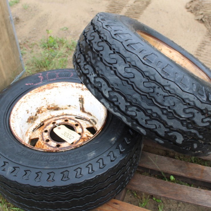 #3002 • (2) 8 lug 12-16.5 rims and tires
