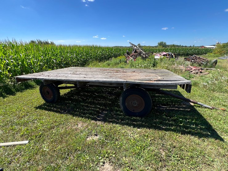 #5722-•-wooden-flat-rack-on-running-gear-image-1