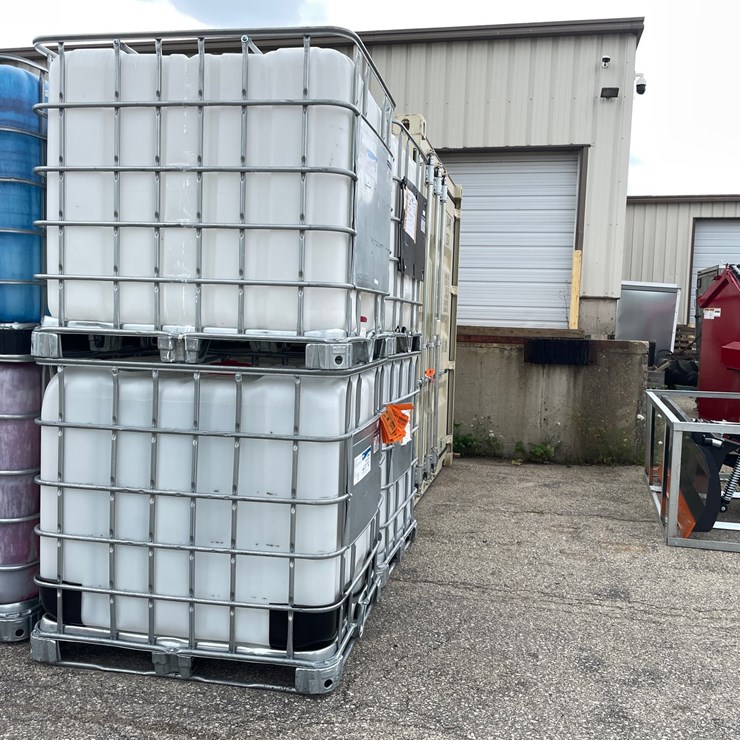 #9034 • (2) 275 Gallon IBC Caged Totes (OF)