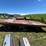 #5719-•-wooden-flat-rack-on-running-gear-image-3
