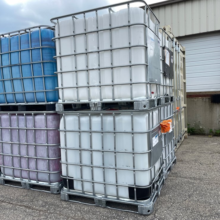 #9027 • (2) 275 Gallon IBC Caged Totes (OF)