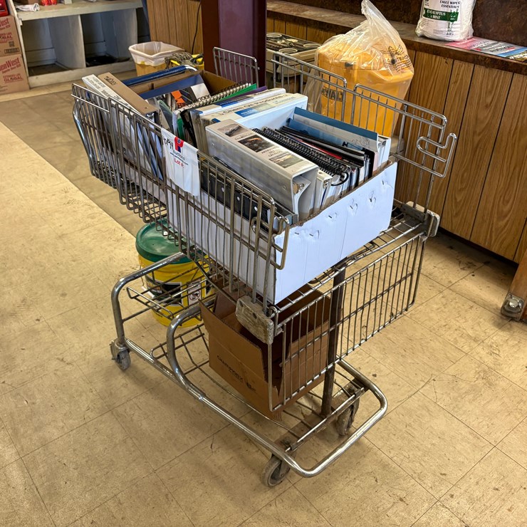 Shopping cart full of assorted oilfield equipment catalogs