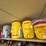 top-shelf-w/-(3)-10-gal-igloo-drinking-coolers,-(1)-gpi-alum-hp-100-hand-pump,-(2)eagel-5-gal.-safety-cans-image-1