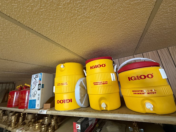 top-shelf-w/-(3)-10-gal-igloo-drinking-coolers,-(1)-gpi-alum-hp-100-hand-pump,-(2)eagel-5-gal.-safety-cans-image-1