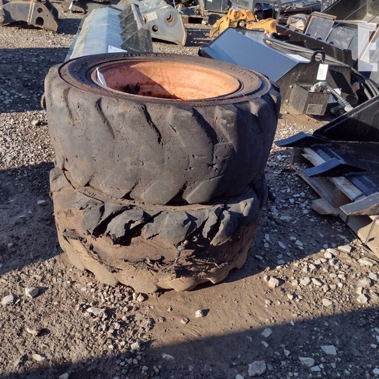 (2) 10-16.5 TIRES W/RIMS