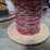 large-wooden-spool-with-cantinos-length-of-mulit-color-stranded-electrical-wire-with-red,-white,-black,-and-green-strands-image-2