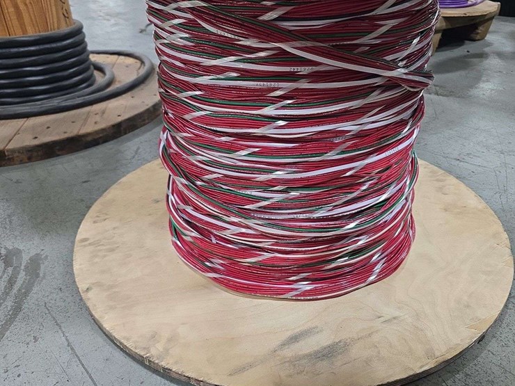 large-wooden-spool-with-cantinos-length-of-mulit-color-stranded-electrical-wire-with-red,-white,-black,-and-green-strands-image-2