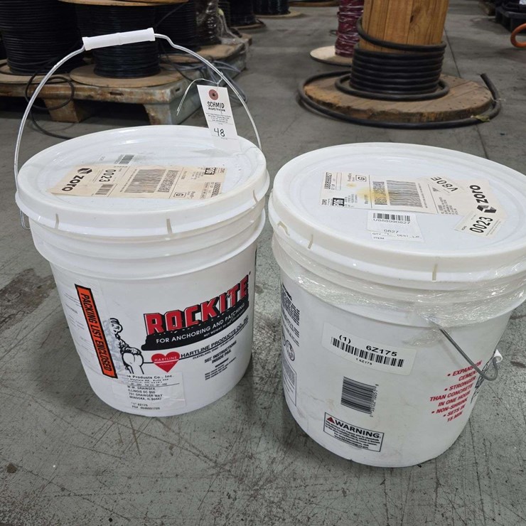 2 Buckets of Rock Tite, 1 new, 1 half full